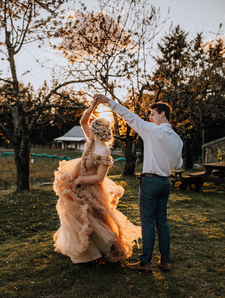 Eloping couple dance in the Vancouver Island sunset