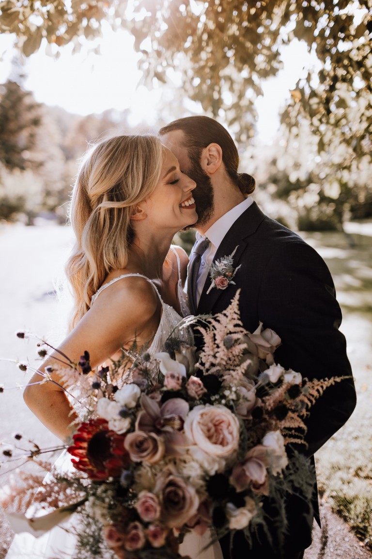 Couple with. Bridal bouquet