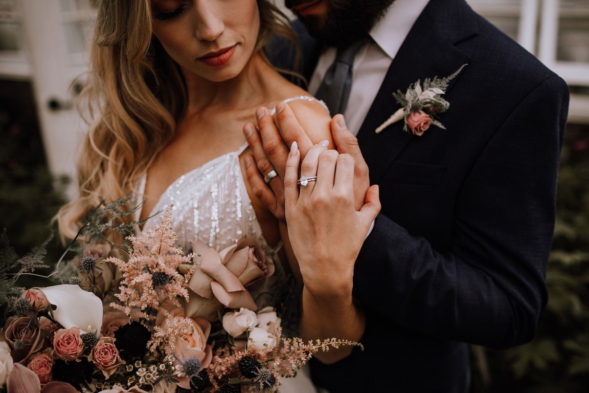 Couple after I do wedding rings