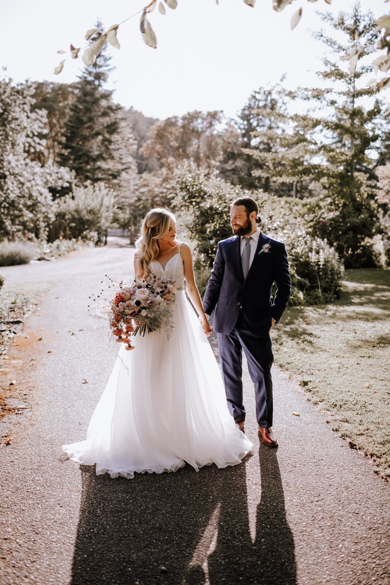 Couple walk hand in hand 