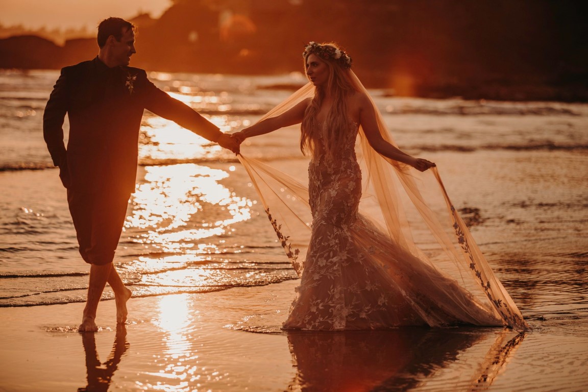 Fiery Sunset Beach Walk Bride and Groom