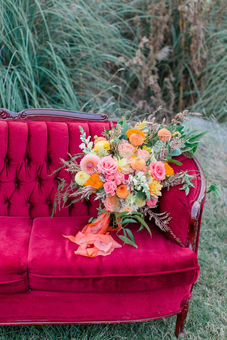 Ruby Red couch with Bridal Bouquet Wizard of Oz theme wedding