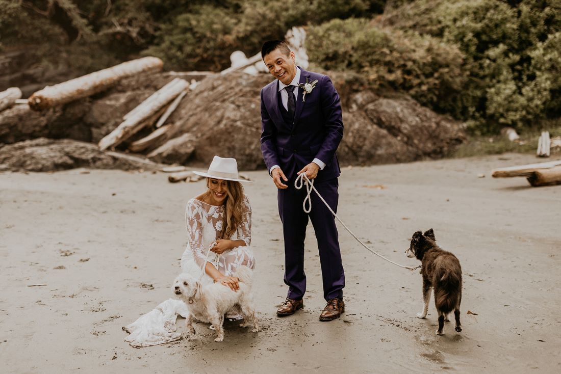 Newlyweds with their dogs on Chesterman Beach in Tofino