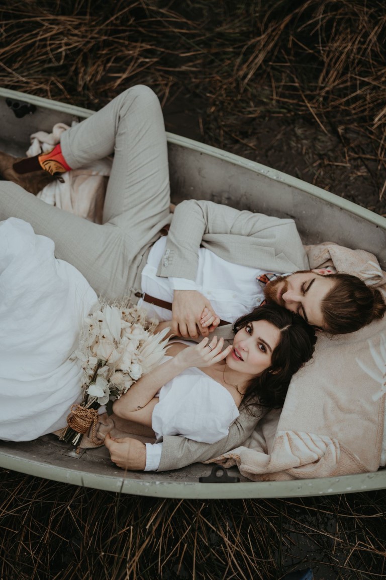 Newlywed Couple Hiding in a Boat