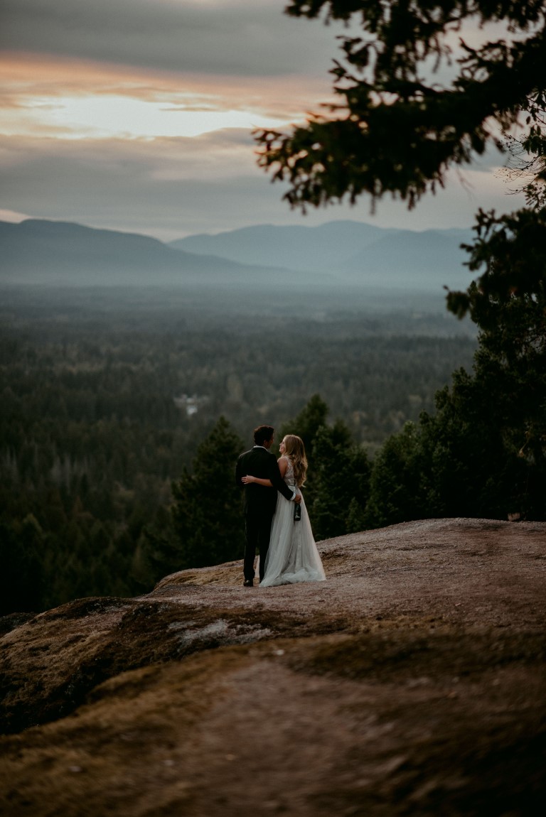 West Coast Wild newlyweds look over mountain views on Vancouver Island