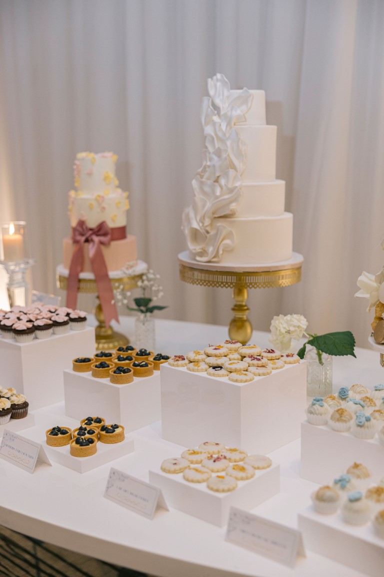 Four tier white wedding cake at Luxe Vancouver 2024