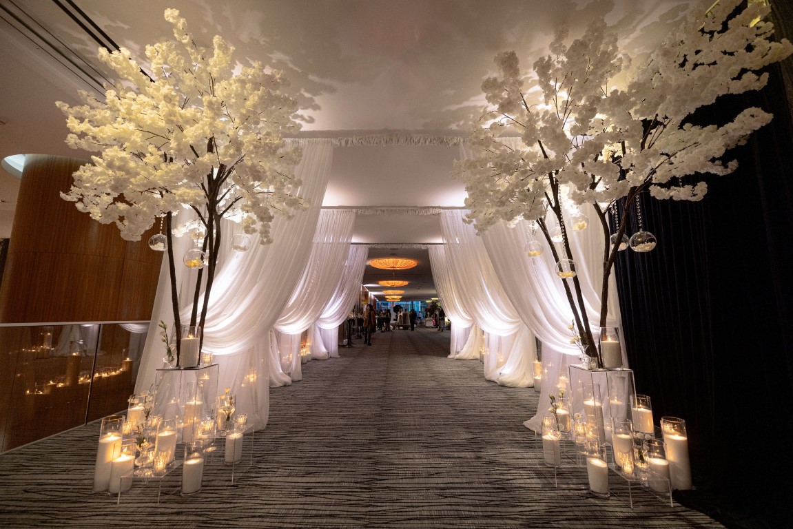 Entrance to Luxe Wedding Show 2024 white trees