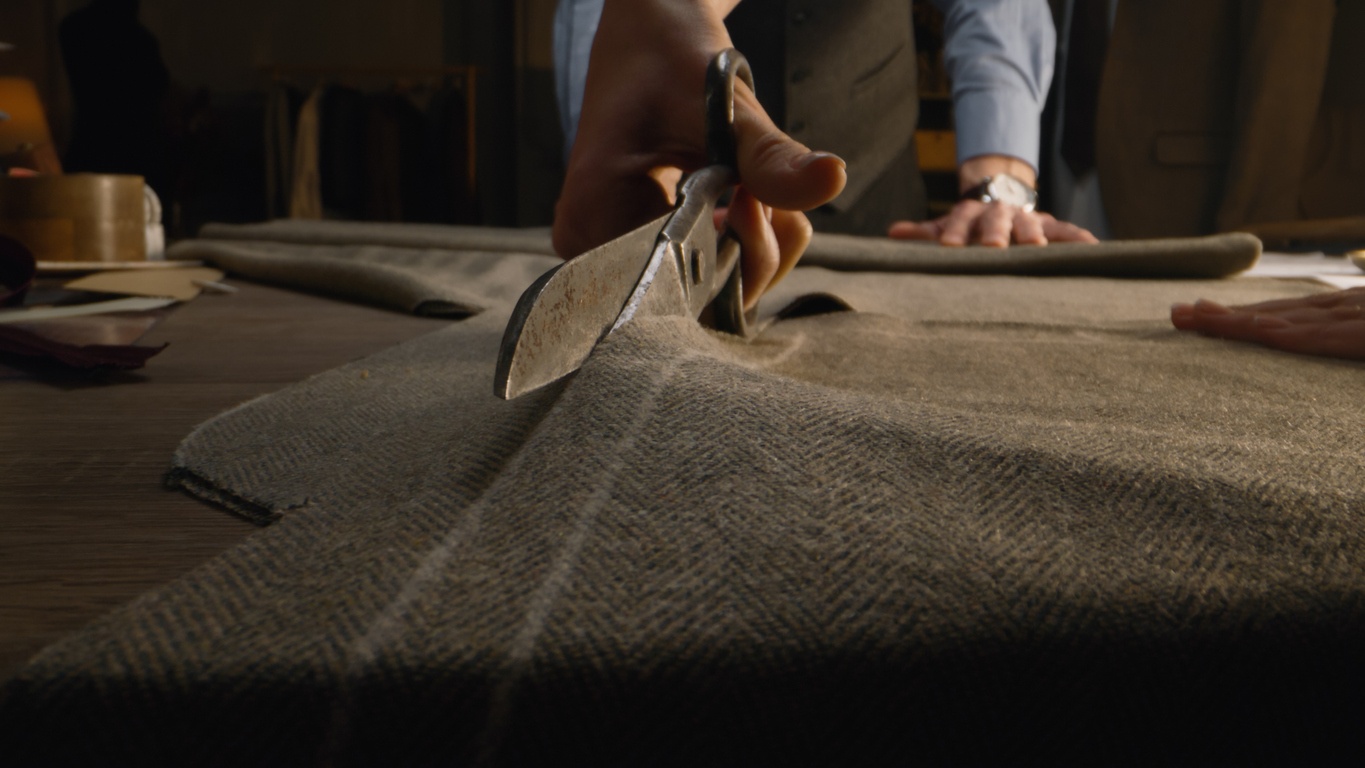 Seville Tailors Vancouver cutting Italian cloth for bespoke suit