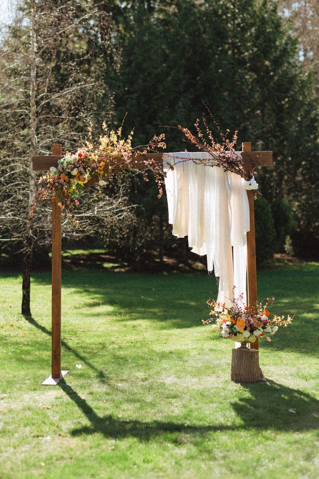 unique floral arch with wildflowers and floral stems