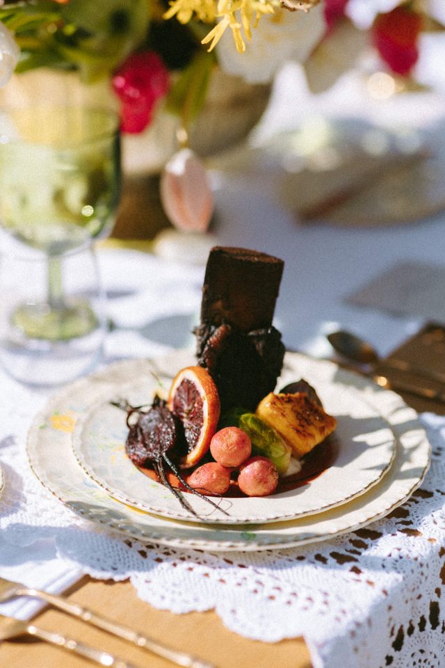 dessert and fruit on China plate with white lace table linen