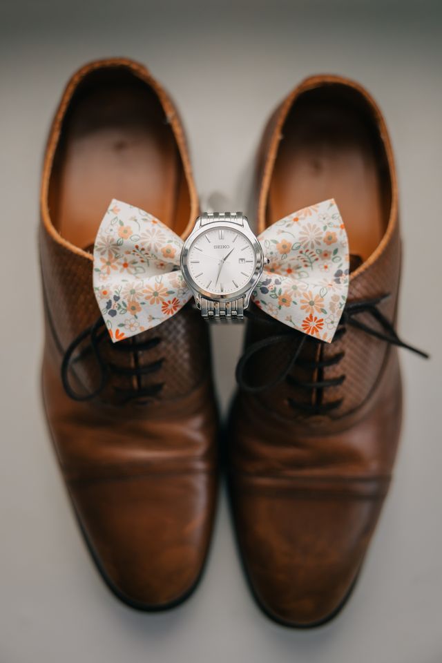 grooms bowtie watch and shoes detail shot