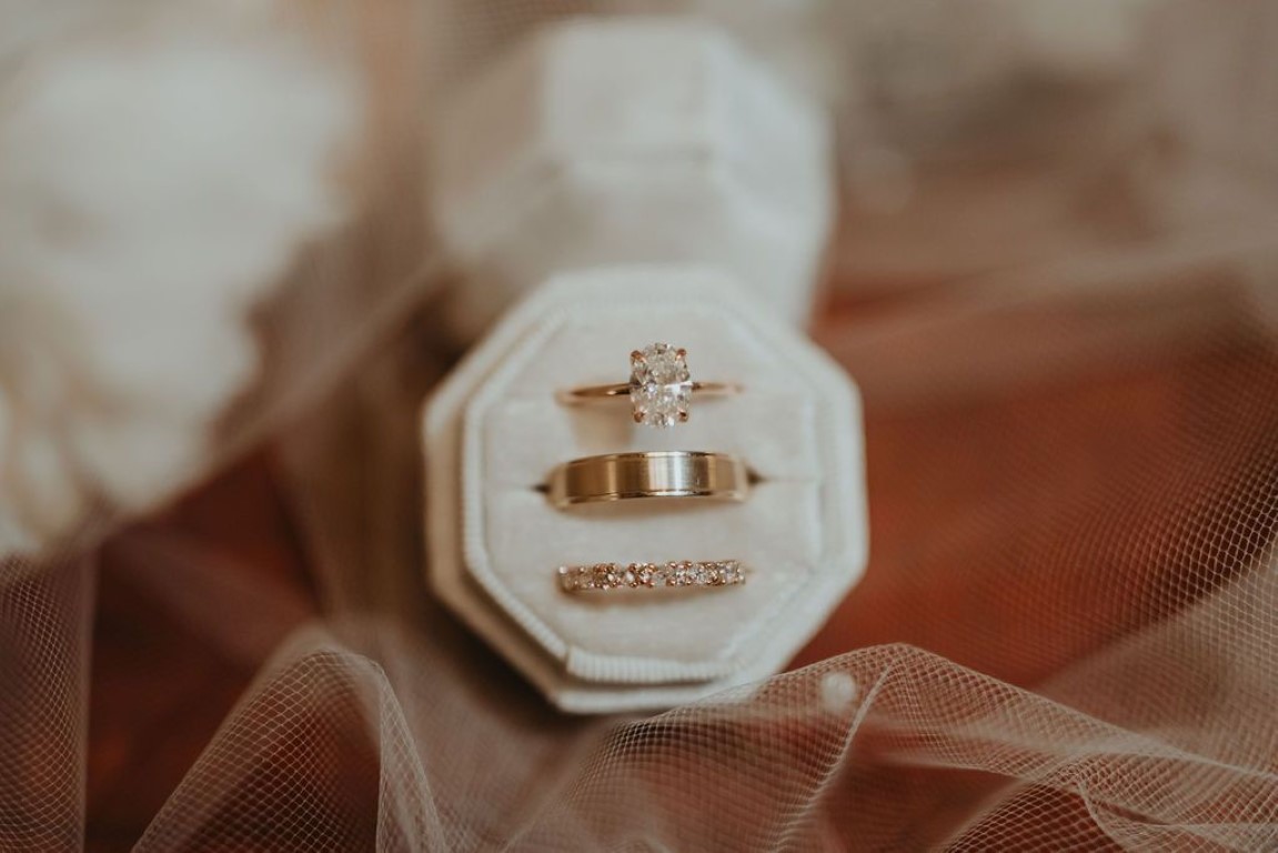 beautiful ring detail shot showcasing wedding band, engagement ring and wedding band