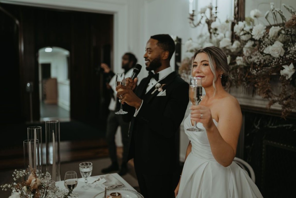 bride and groom cheers to their guests