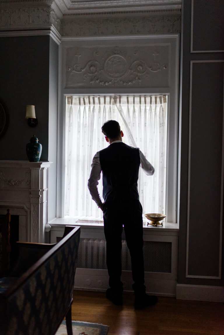 groom looks out his window