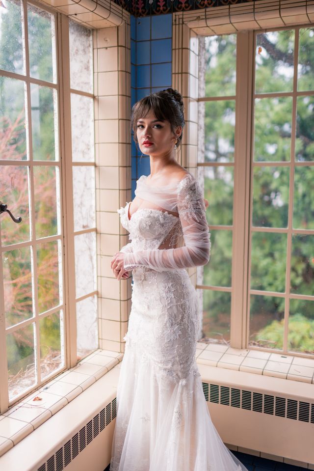 bride in bridal gown with shawl jacket sleeve detail