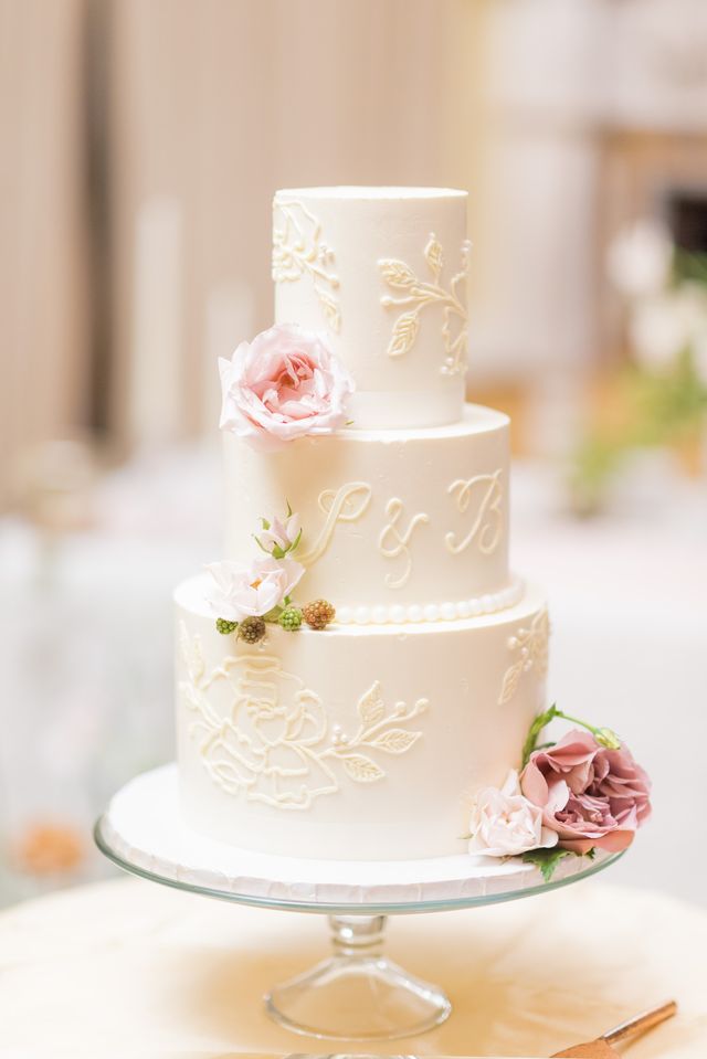 3 tier white wedding cake with rose, leaf and pearl detail