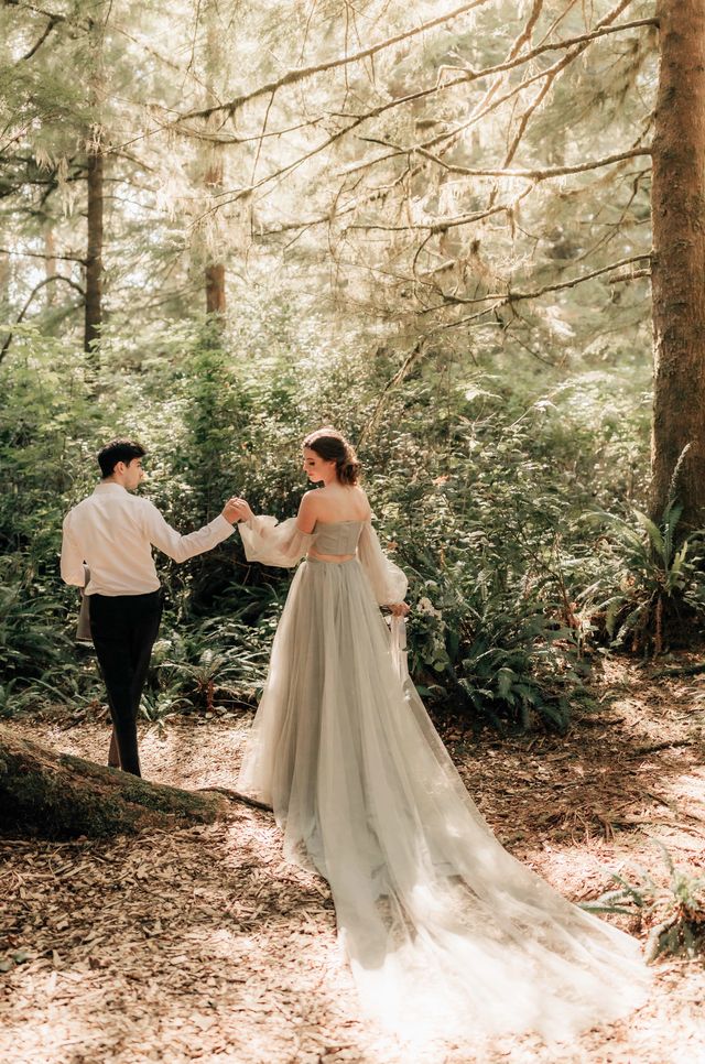 bride and groom walk hand in hand