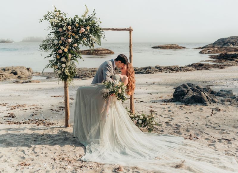 bride and groom lean in for kiss