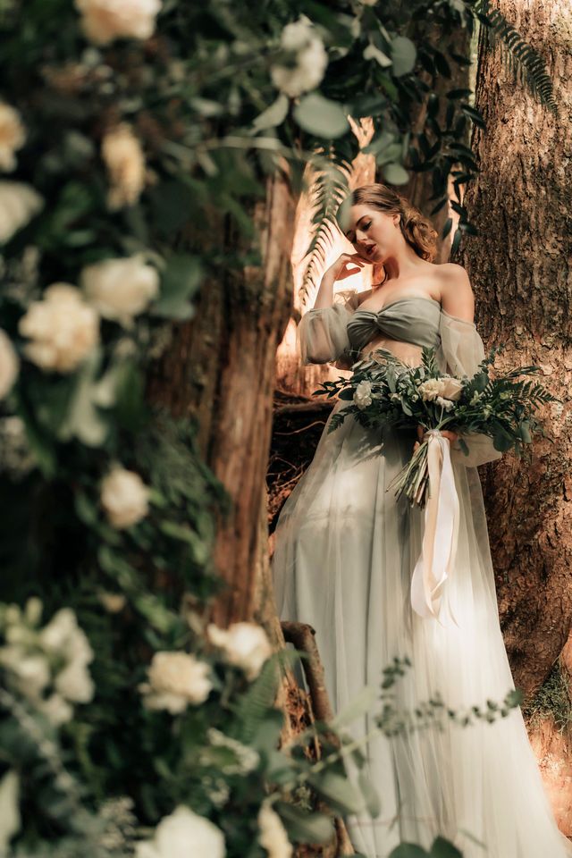 bride ponders in tree