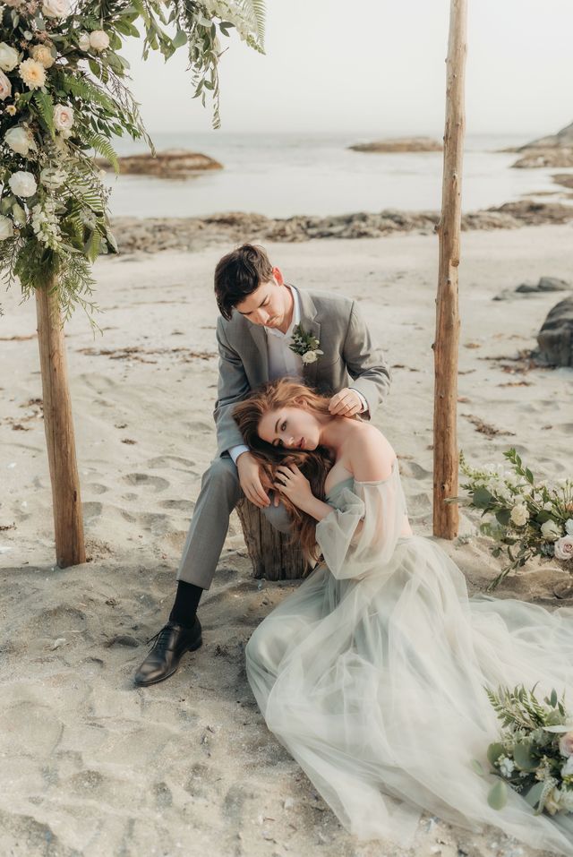 bride lays head on grooms knee