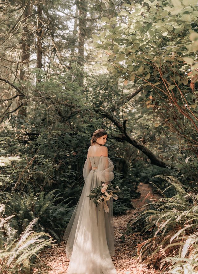 bride poses looking back at camera