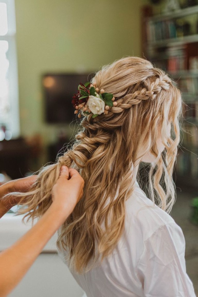 soft bridal braid in the brides hair with fresh rose floral detail