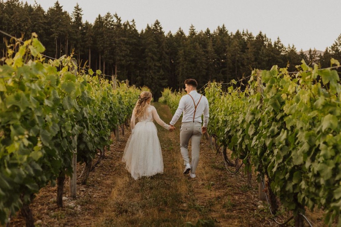 newlywed stroll in vineyard on Vancouver Island