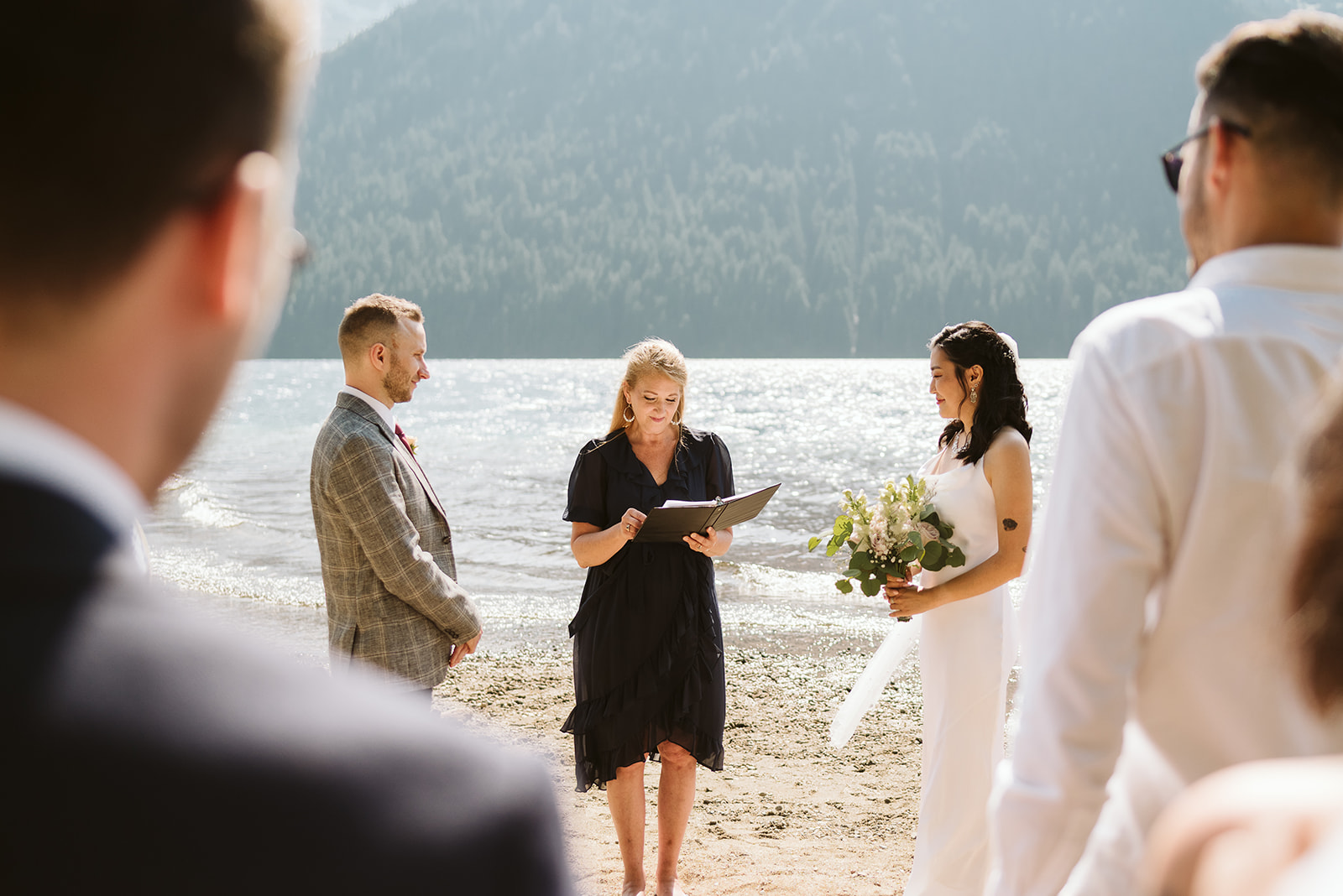 Ceremony by mountain lake by Jordyn Keller Photography