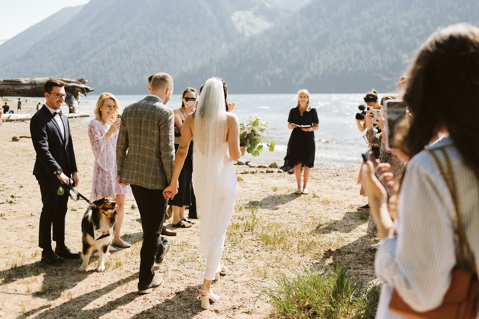 Bride and groom walk down aisle at mountain wedding