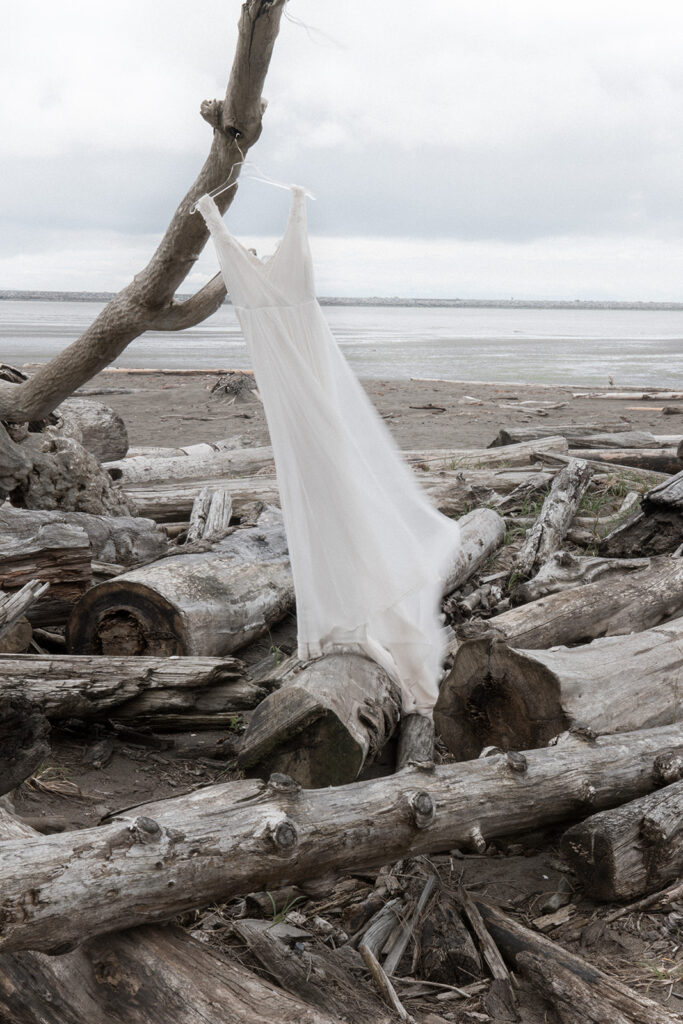 Jenny Yoo wedding gown blows in the wind on Vancouver beach