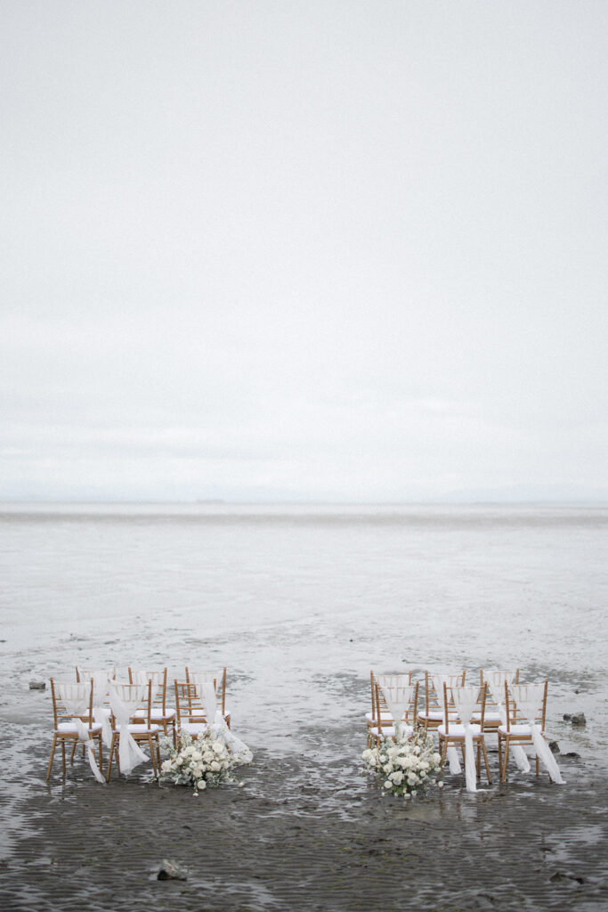 gold Chiavari chairs in the vancouver beach tide by Allison Taylor