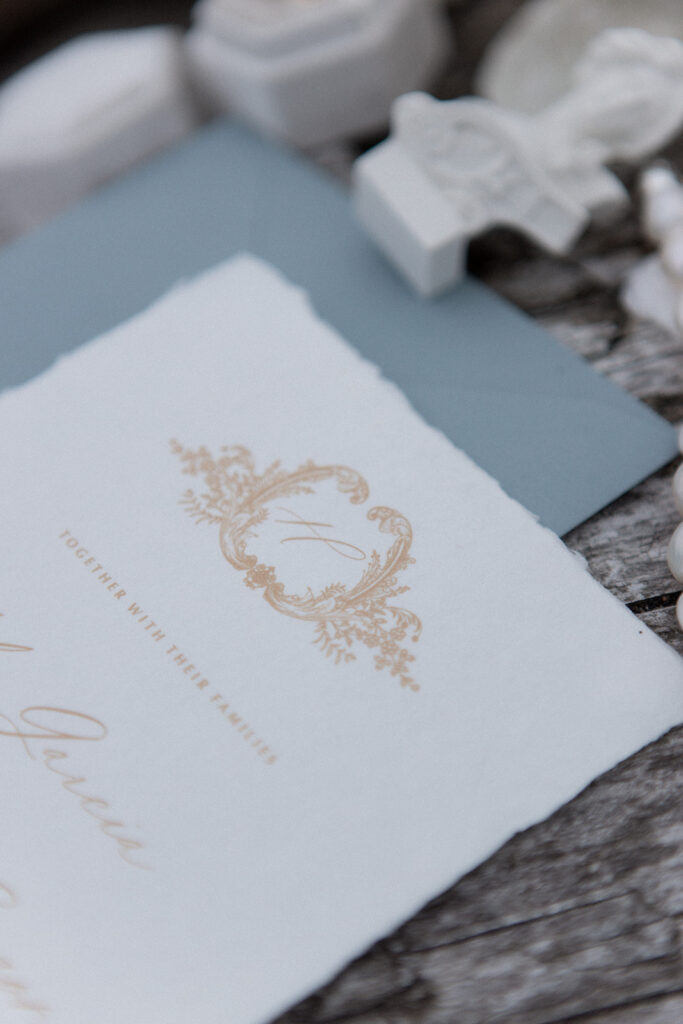 light blue and gold embossed wedding invite by Studio Lavender