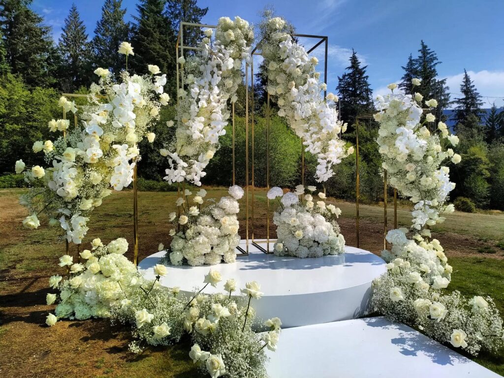 Vancouver outdoor wedding ceremony backdrop lush white flowers PROLINE