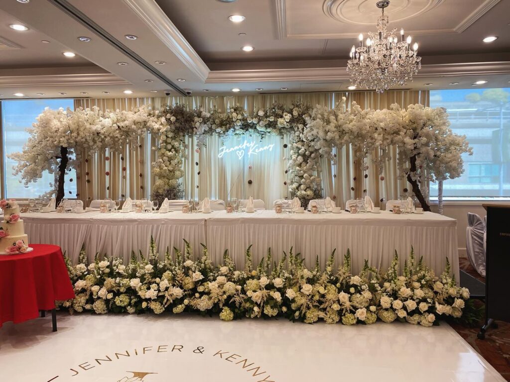 lush white rose wedding head table by Proline Decor Vancouver