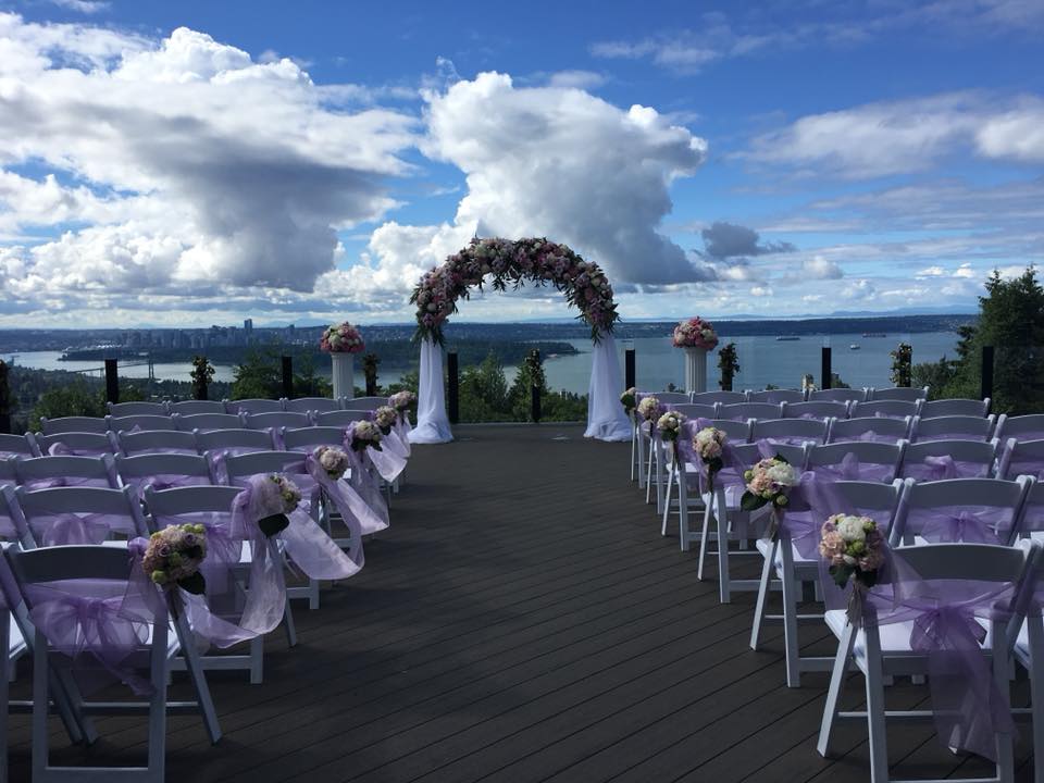 outdoor ceremony with water view and hundreds of roses by PROLINE vancouver