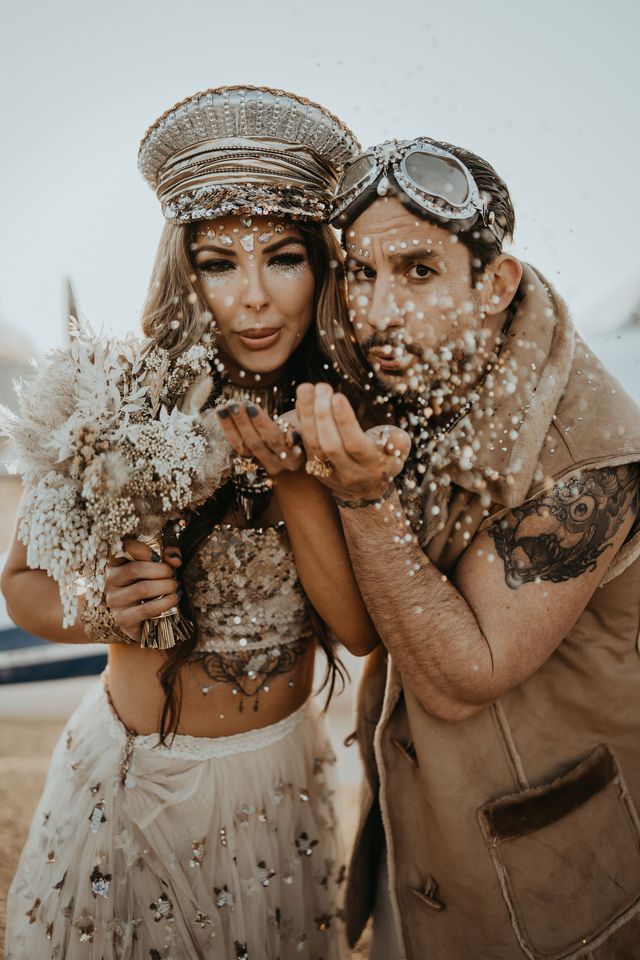 Newlyweds blow glitter at airport runaway elopement