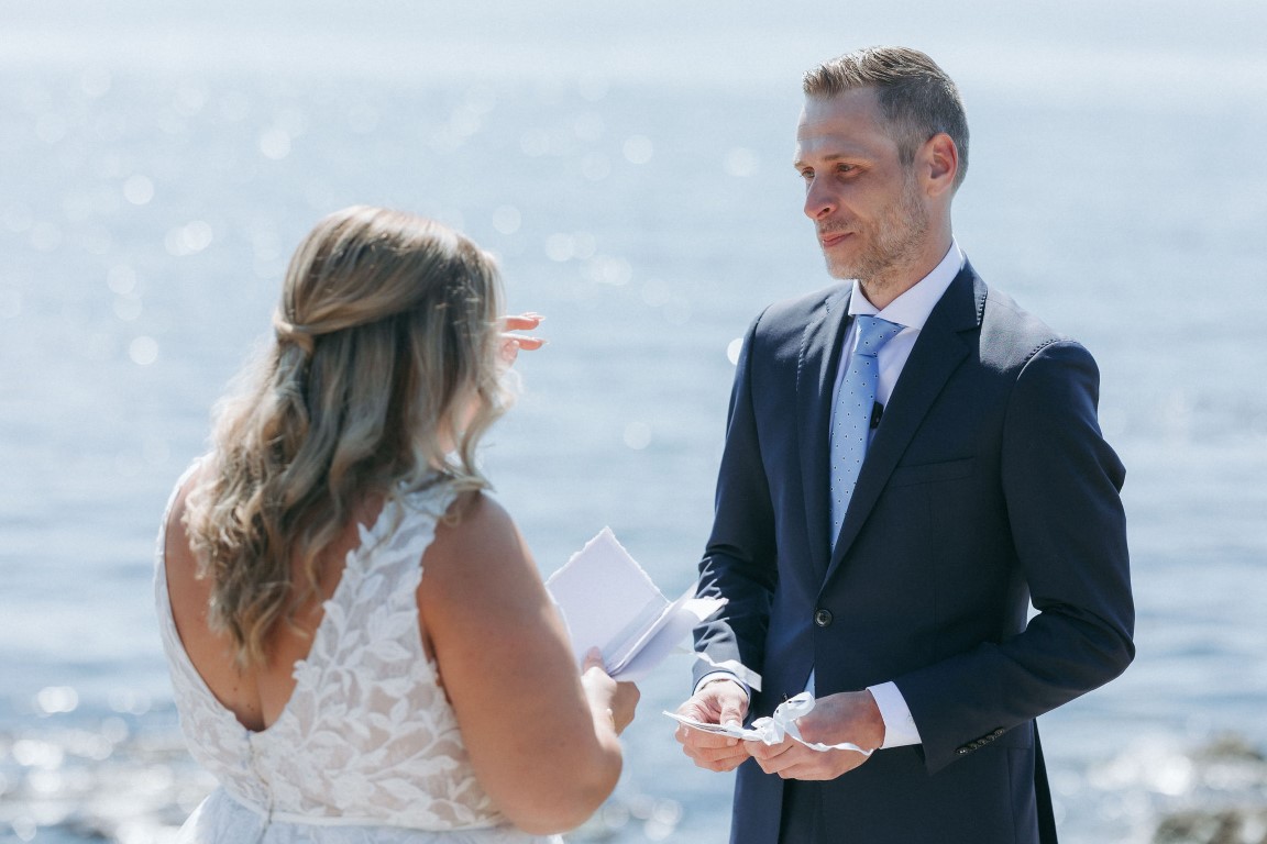 Bride and groom exchange personal vow books at first look by Robyn Paige