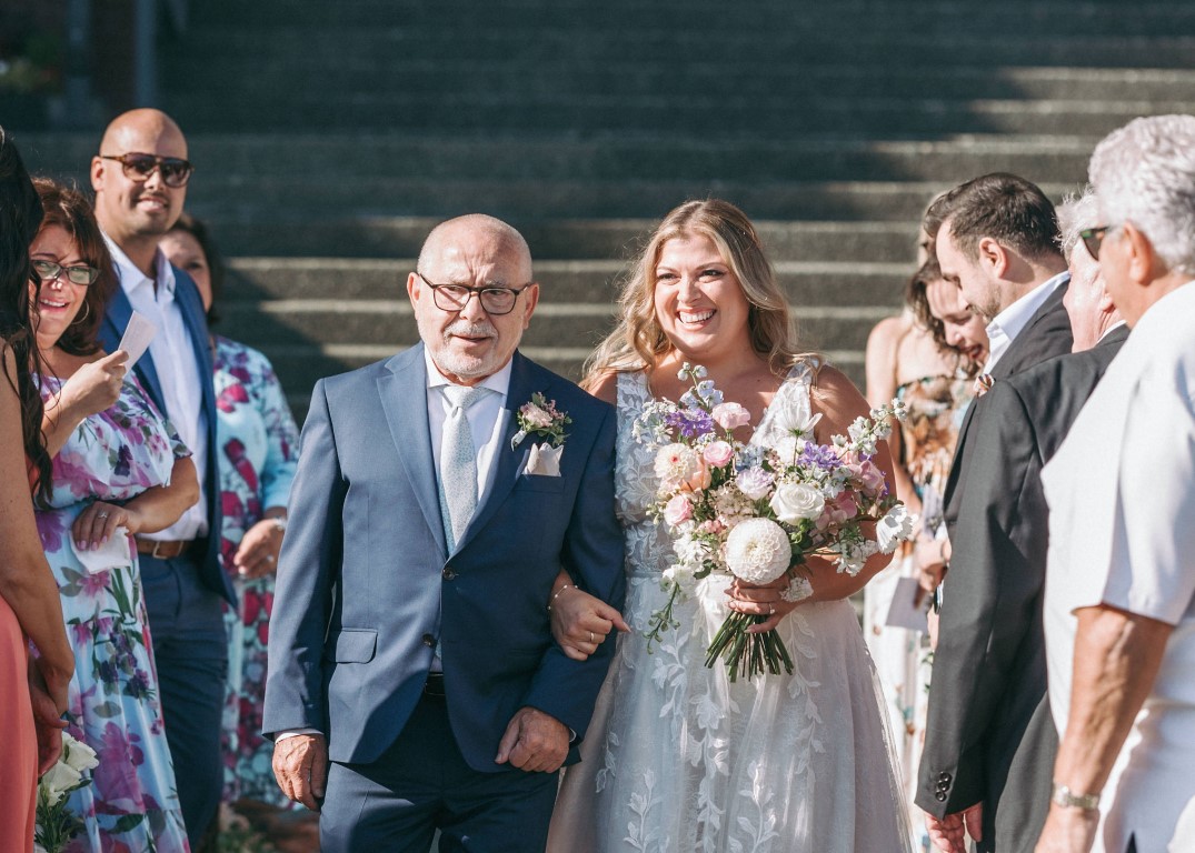 Bride and father walk down the aisle at Delta Ocean Pointe Victoria