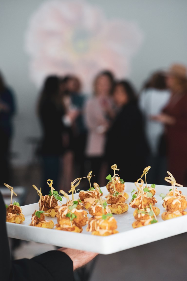 guests look at Edge Catering canapes at Vancouver event