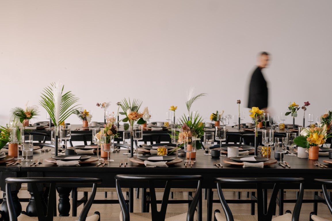 Minimalist palm leaf wedding reception tables