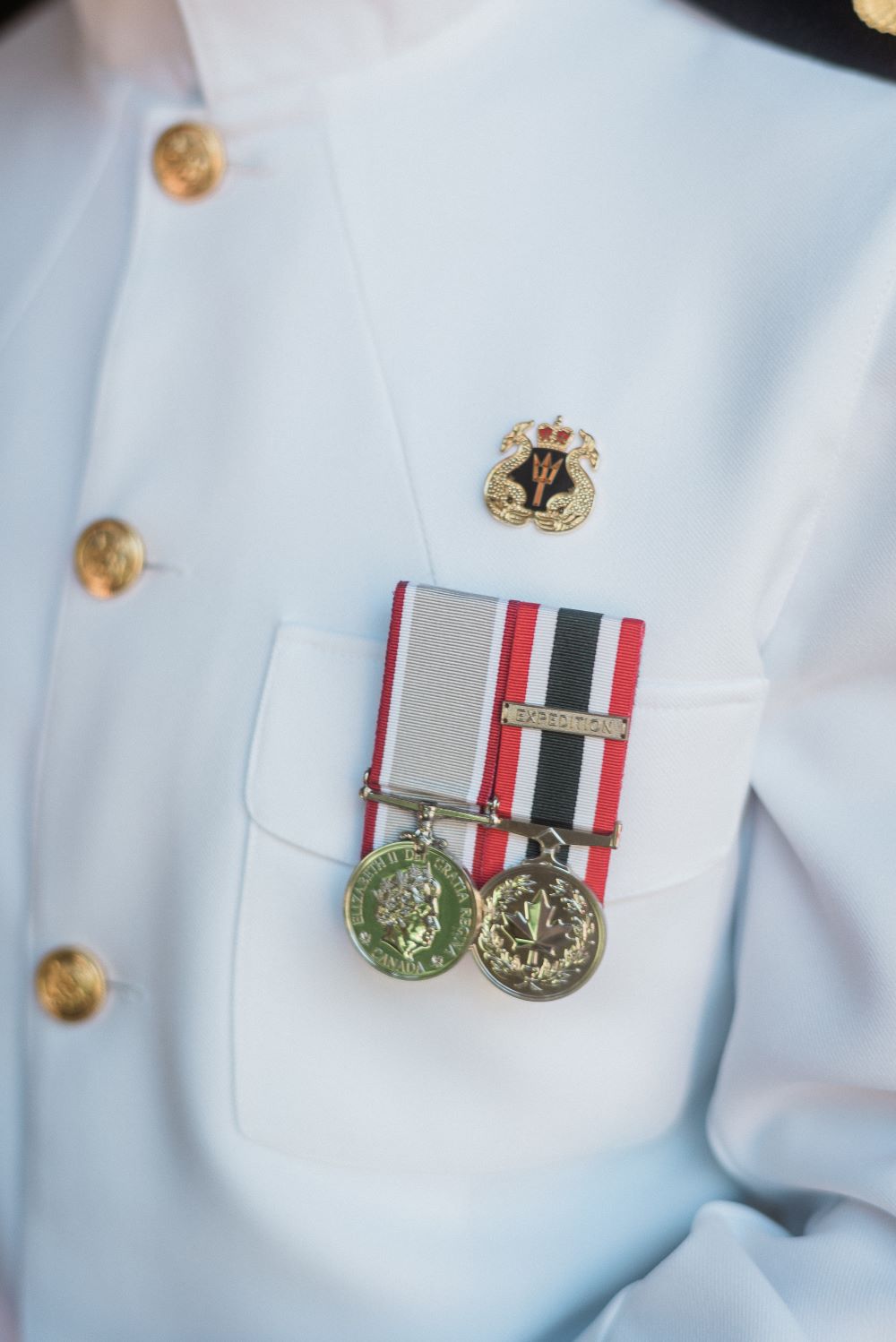 Grooms medals on his dress whites