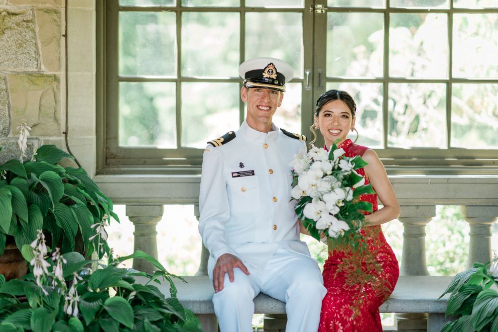 Newlyweds sit in Hatley Castle pergola 