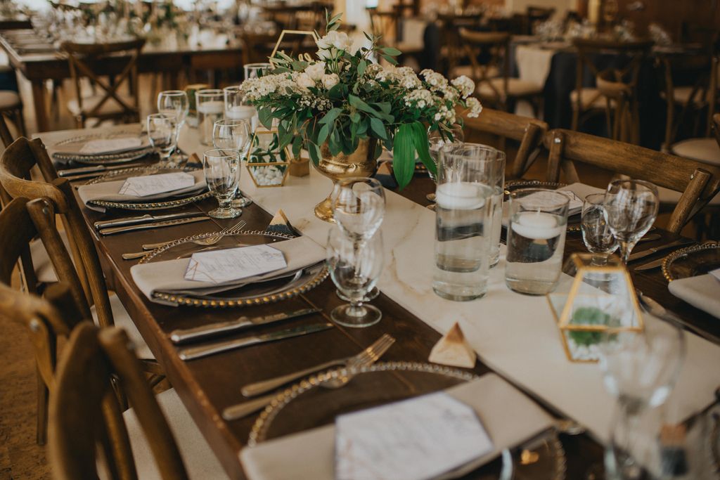 glass plates on white and green wedding decor table