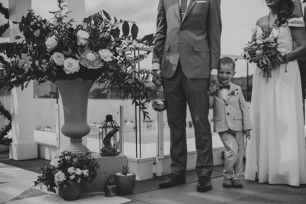 Little boy waits by groom at Kelowna wedding