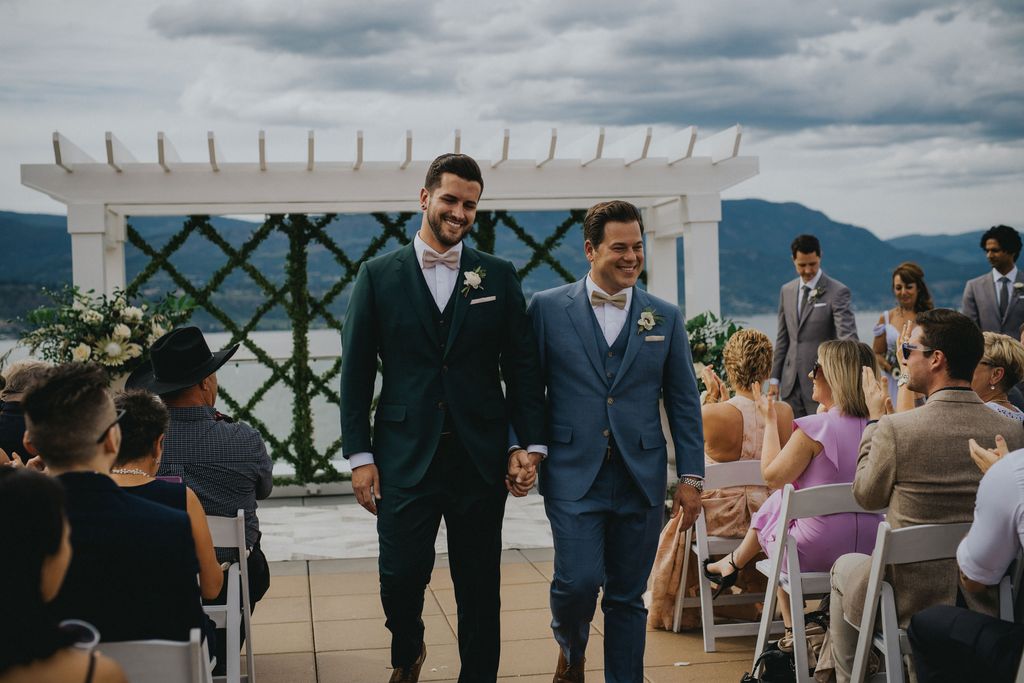 Grooms walk down the aisle at Hotel Eldorado