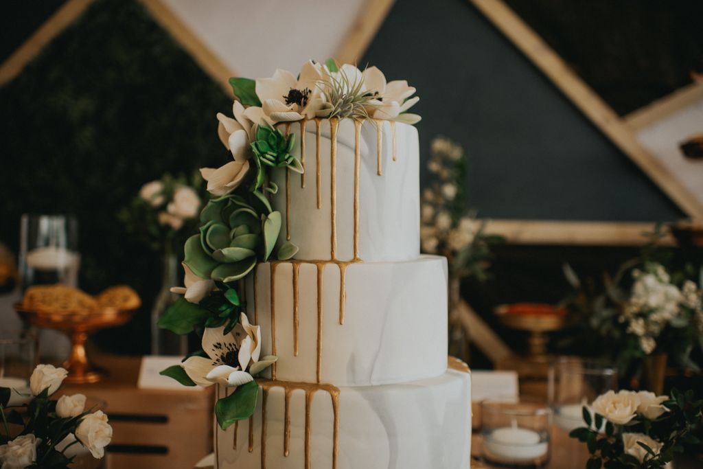 Three layer white wedding cake with anemones by Whisk Bakery Kelowna