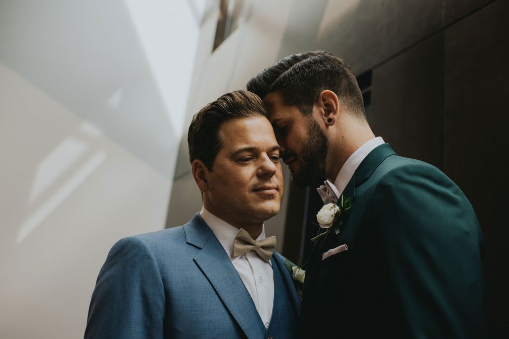 LGBTQ grooms in blue suits by Joelsview Photography