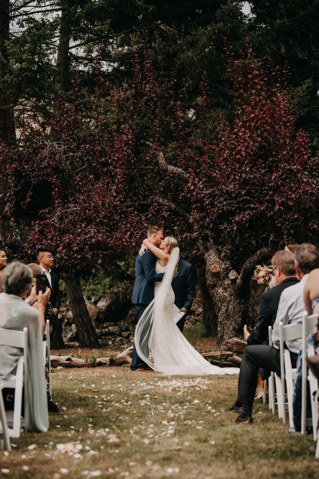 Newlywed kiss at Pender Island wedding ceremony