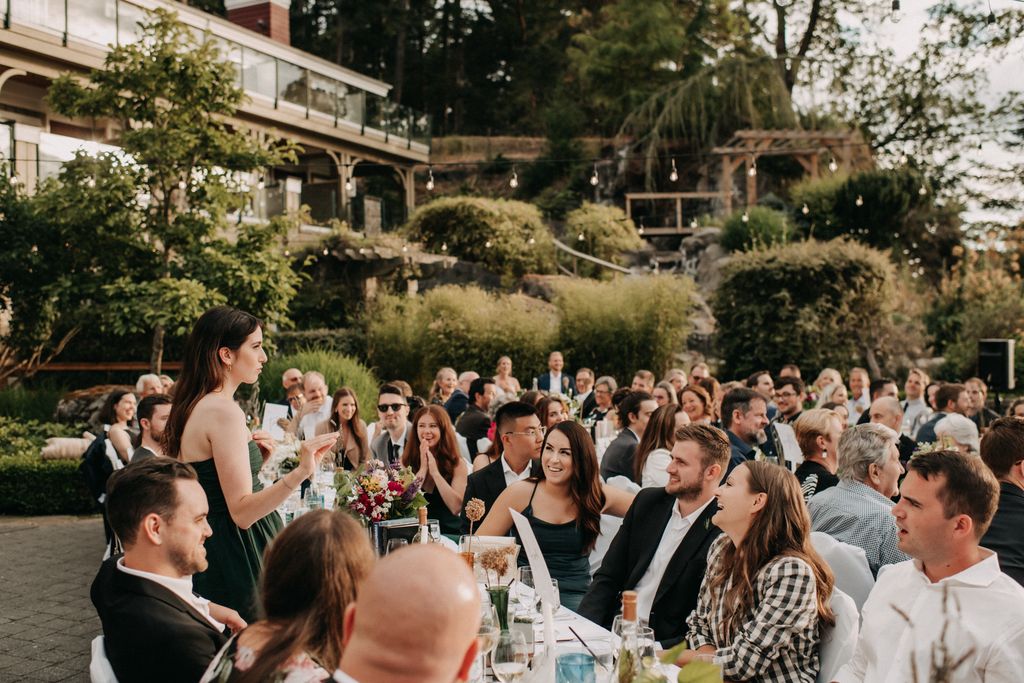 A toast by bridesmaid at Poets Cove