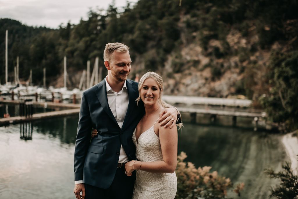 Happy newlyweds on Poet's Cove Resort dock